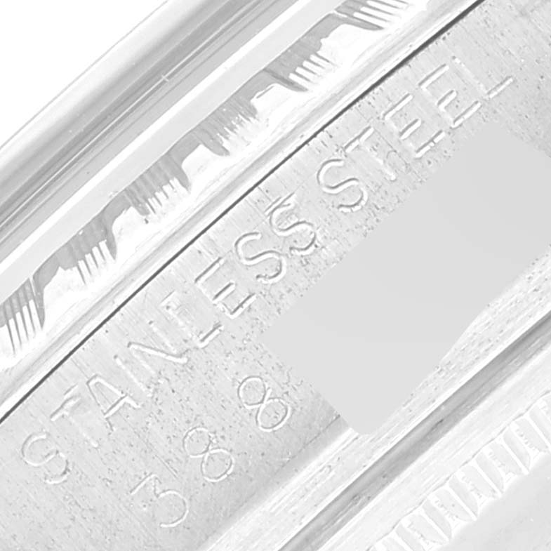 The image shows a close-up angle of the stainless steel and engraved serial number on the Rolex Datejust 1601 Men's Stainless Steel Silver Dial 1601 Men's Stainless Steel Silver Dial model's case.