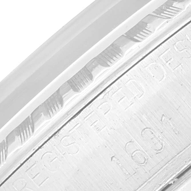 This image shows a close-up of the case edge and engraved markings of a Rolex Datejust 1601 Men's Stainless Steel Silver Dial 1601 Men's Stainless Steel Silver Dial watch.