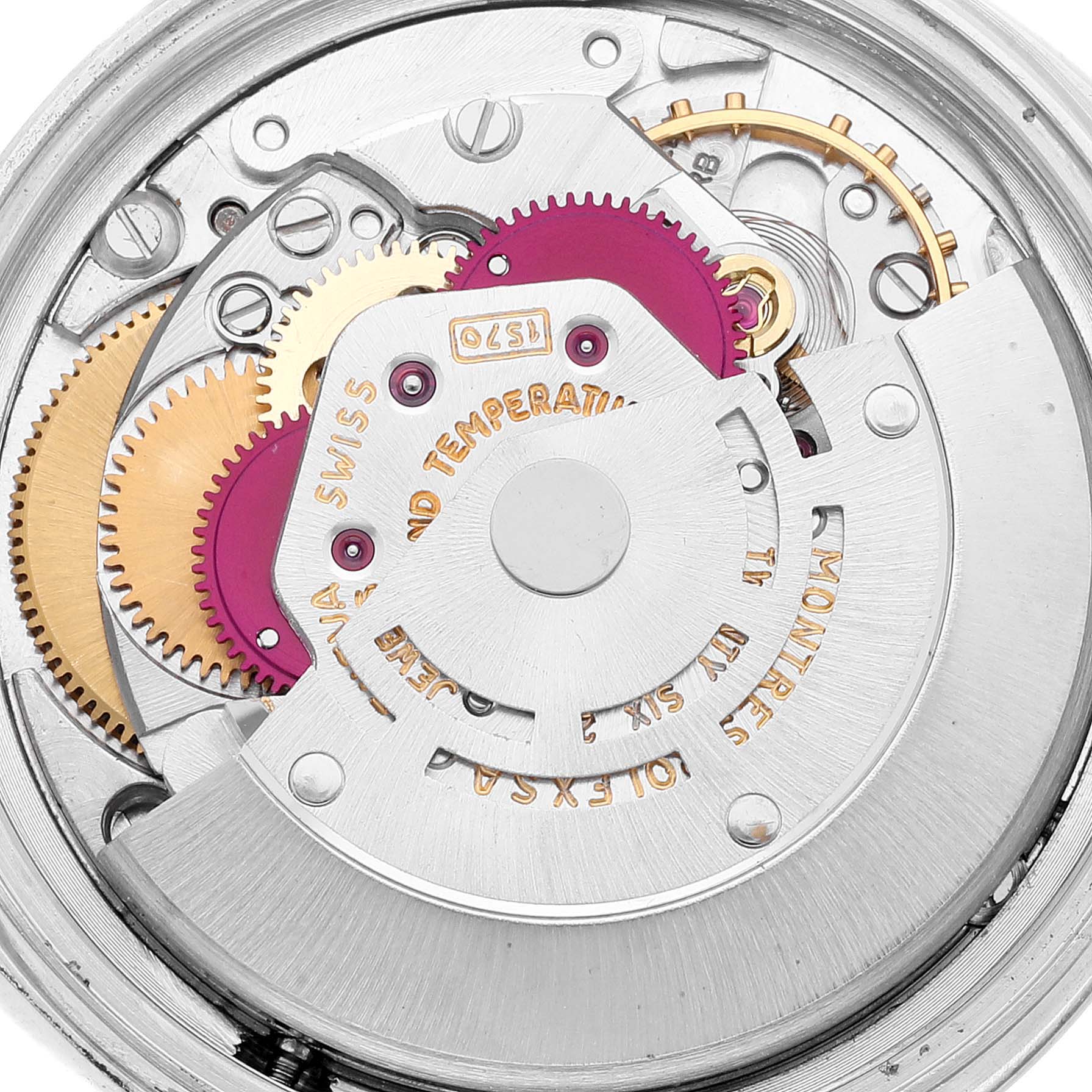 This close-up image of the Rolex Datejust 1601 Men's Stainless Steel Silver Dial 1601 Men's Stainless Steel Silver Dial watch shows the intricate internal mechanical parts and gears.