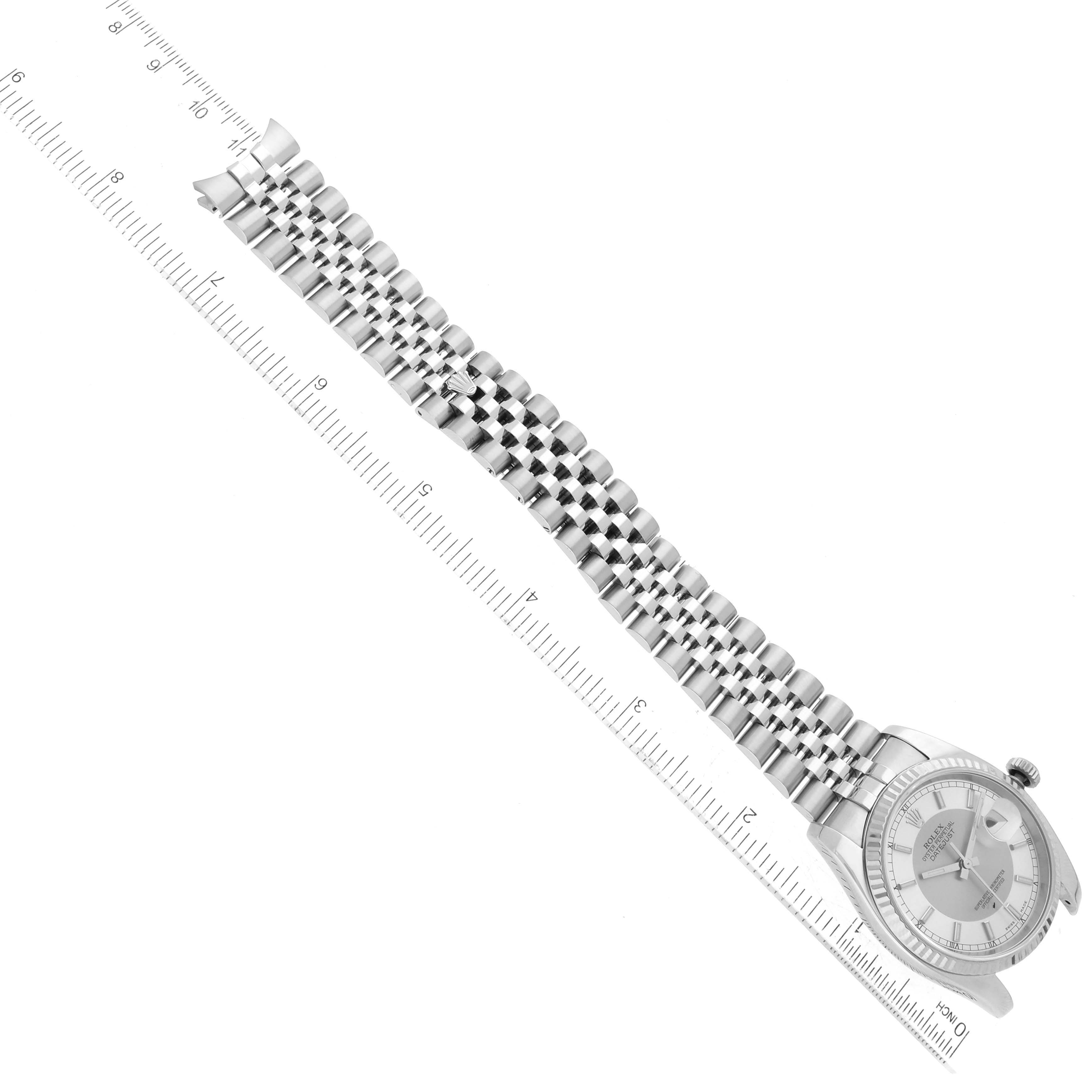 The image shows a Rolex Datejust 116234 Men's Stainless Steel Silver Dial 116234 Men's Stainless Steel Silver Dial model laid flat with a ruler, presenting the dial and full bracelet.