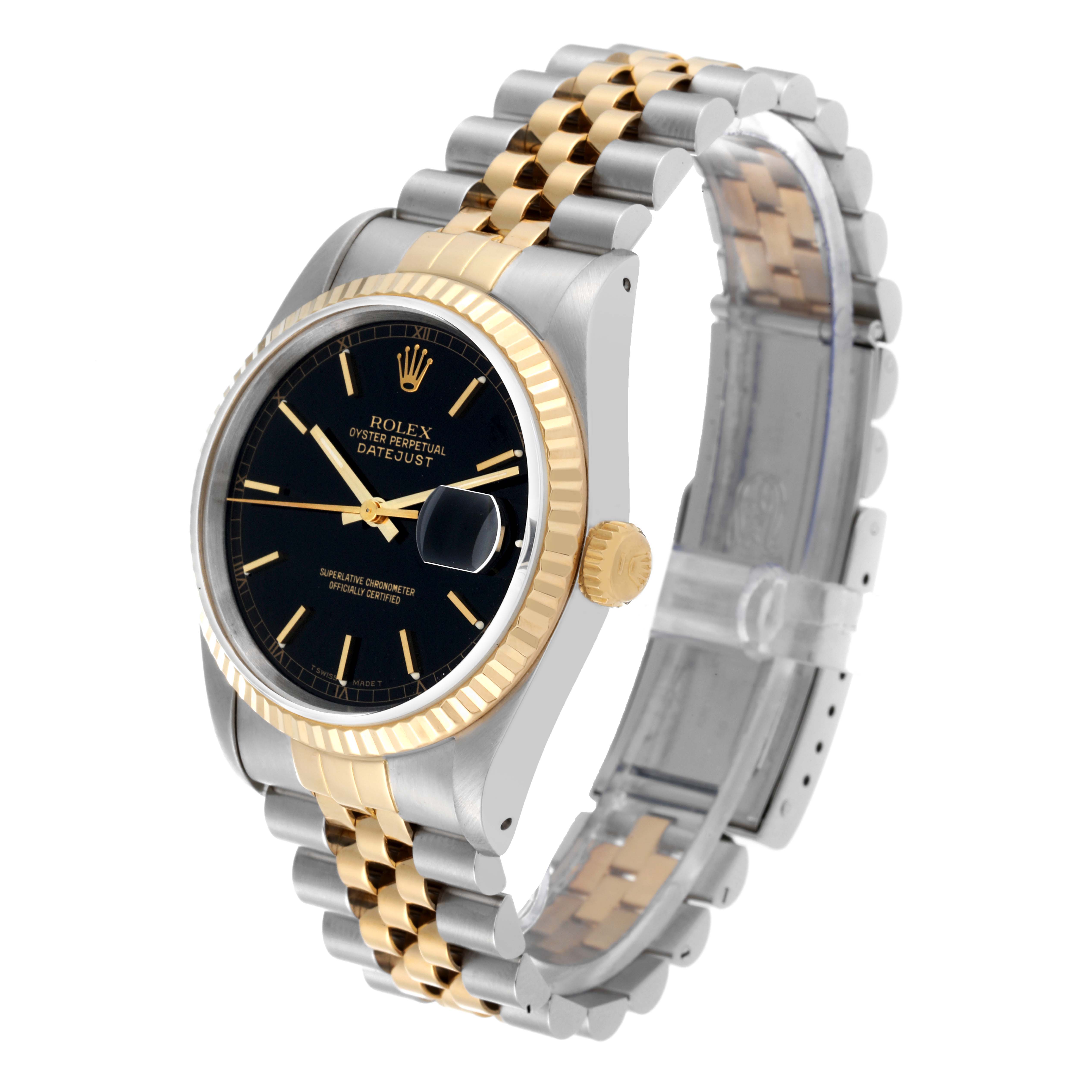 The image shows a Rolex Datejust 16233 Men's Steel and Gold (two tone) Black Dial 16233 Men's Steel and Gold (two tone) Black Dial watch at an oblique angle, highlighting its face, fluted bezel, crown, and two-tone bracelet.