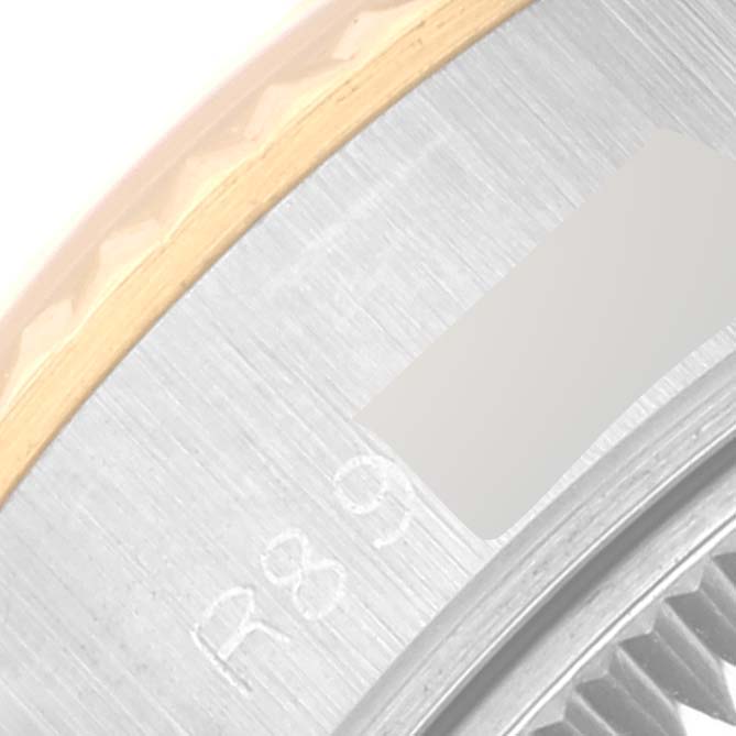 This close-up angle shows parts of the bezel and dial of a Rolex Datejust 69173 Women's Steel and Gold (two tone) Champagne Dial 69173 Women's Steel and Gold (two tone) Champagne Dial watch.
