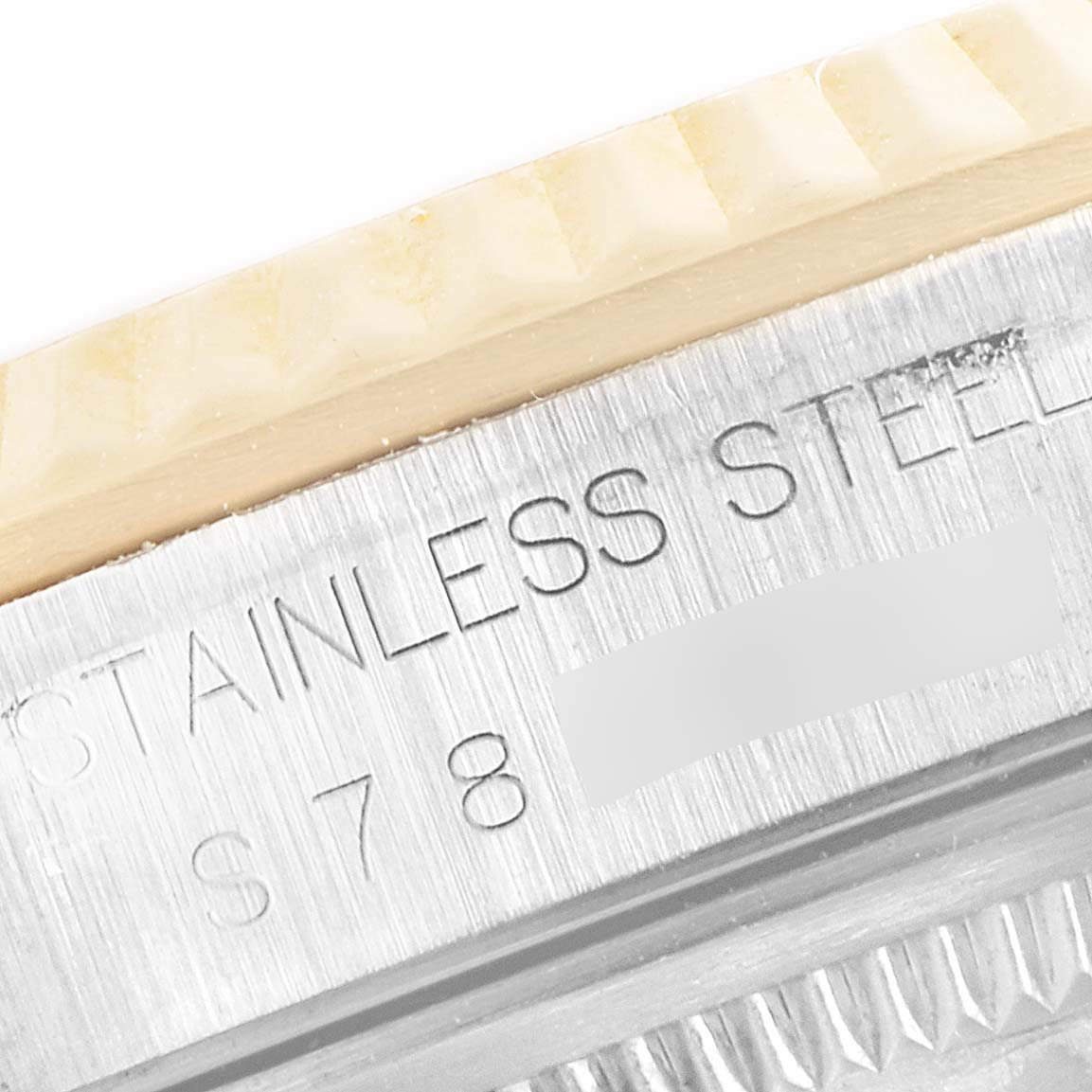 The image shows a close-up angle of the bezel and part of the stainless steel case of a Rolex Datejust 16233 Men's Steel and Gold (two tone) Champagne Dial 16233 Men's Steel and Gold (two tone) Champagne Dial watch.