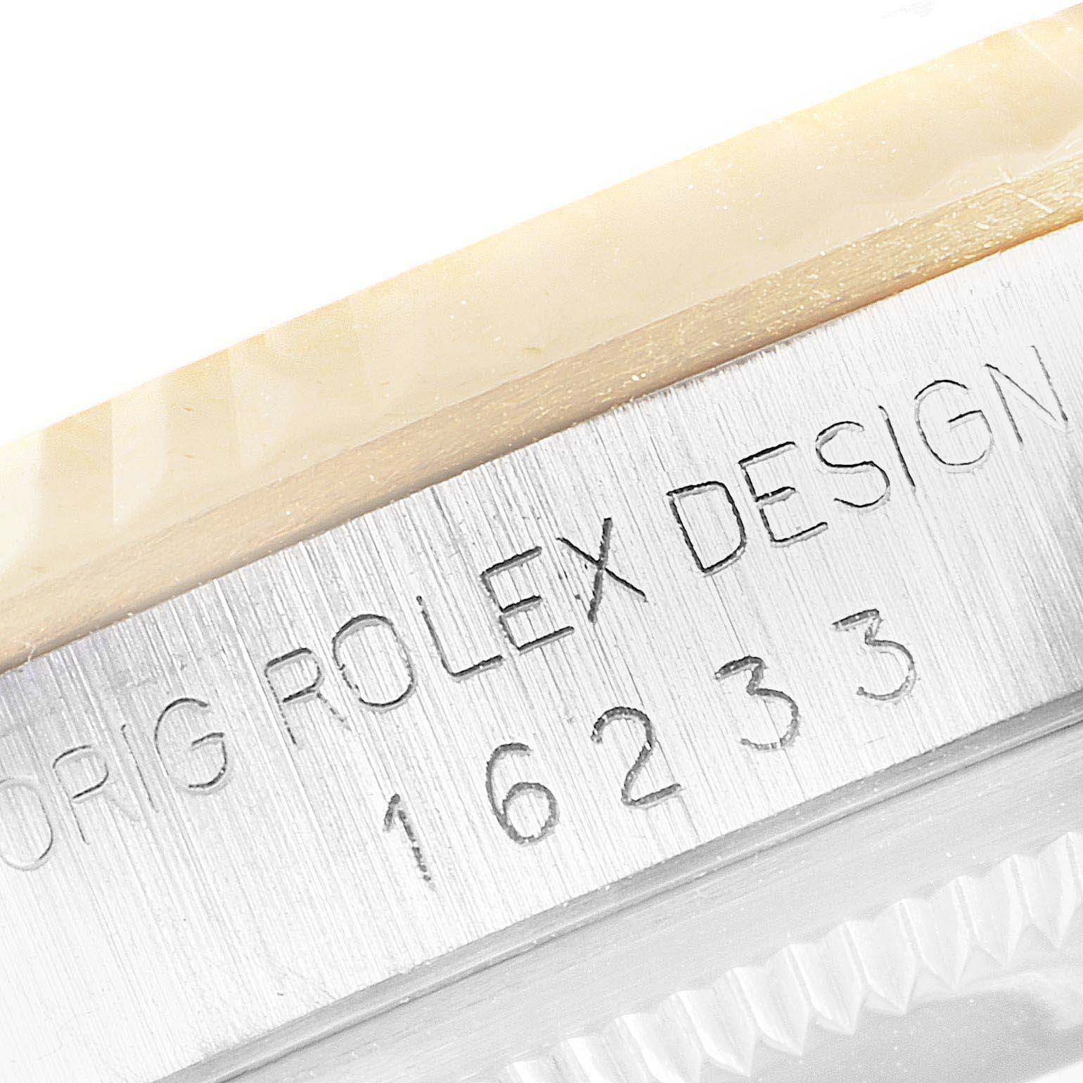 Close-up of the case side, model number, and part of the bezel of the Rolex Datejust 16233 Men's Steel and Gold (two tone) Champagne Dial 16233 Men's Steel and Gold (two tone) Champagne Dial model.