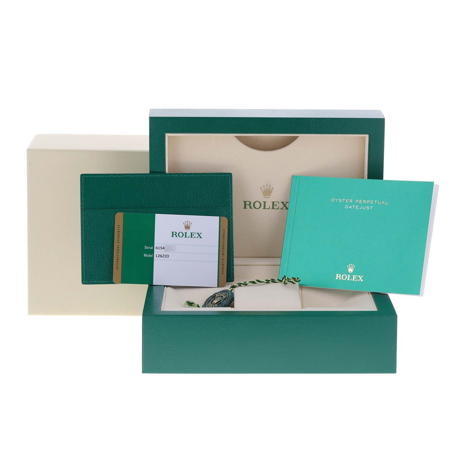 This image displays the packaging and accessories for a Rolex Datejust 126233 Men's Steel and Gold (two tone) Green Dial 126233 Men's Steel and Gold (two tone) Green Dial, including the box, warranty card, and instruction booklet.