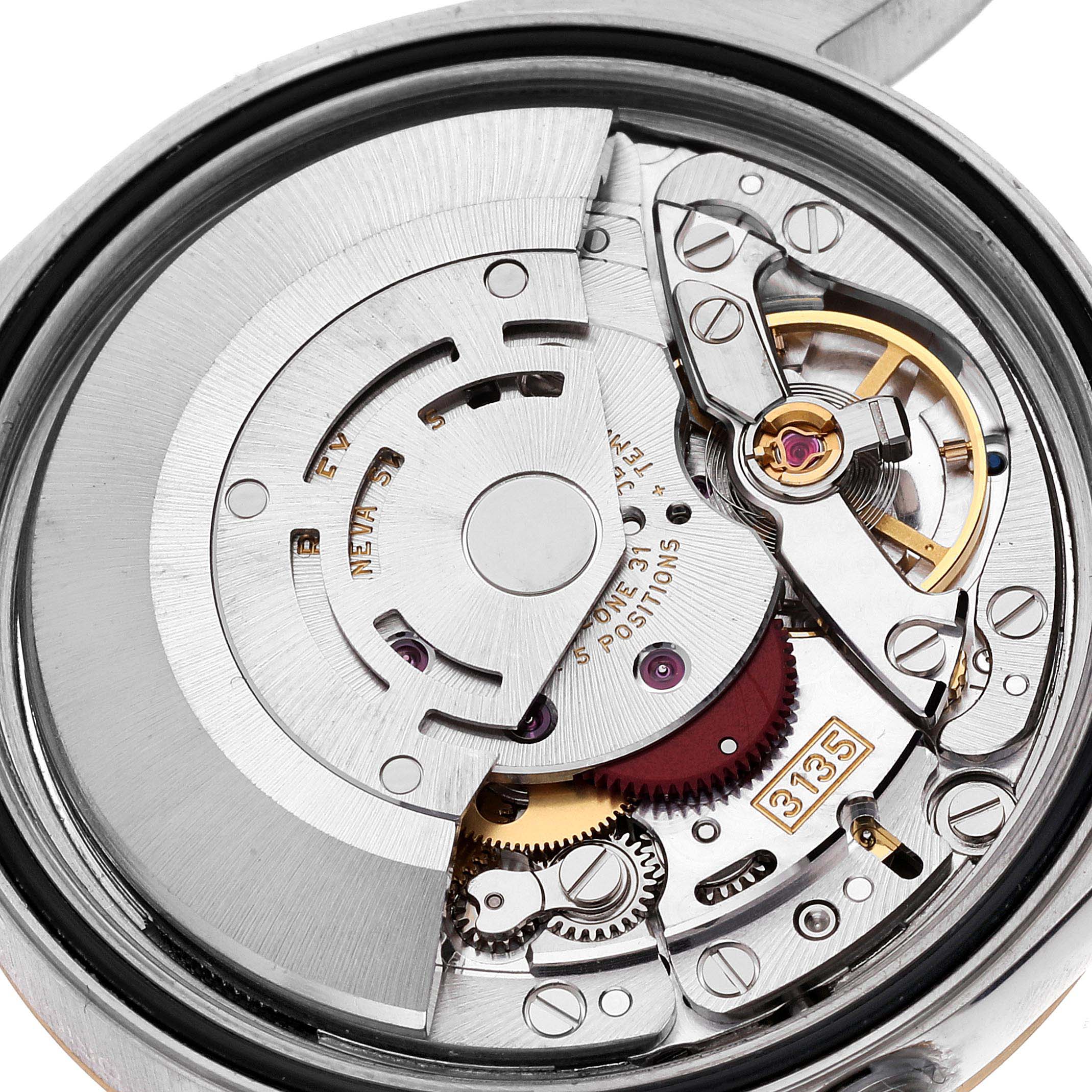 This image shows the internal mechanism of a Rolex Datejust 16233 Men's Steel and Gold (two tone) Mother of Pearl Dial 16233 Men's Steel and Gold (two tone) Mother of Pearl Dial watch, focusing on the movement and intricate parts.