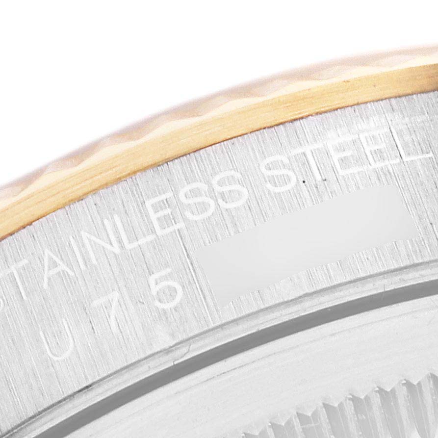 The image shows a close-up of the case back edge and partial engravings on a Rolex Datejust 16233 Men's Steel and Gold (two tone) Mother of Pearl Dial 16233 Men's Steel and Gold (two tone) Mother of Pearl Dial watch.