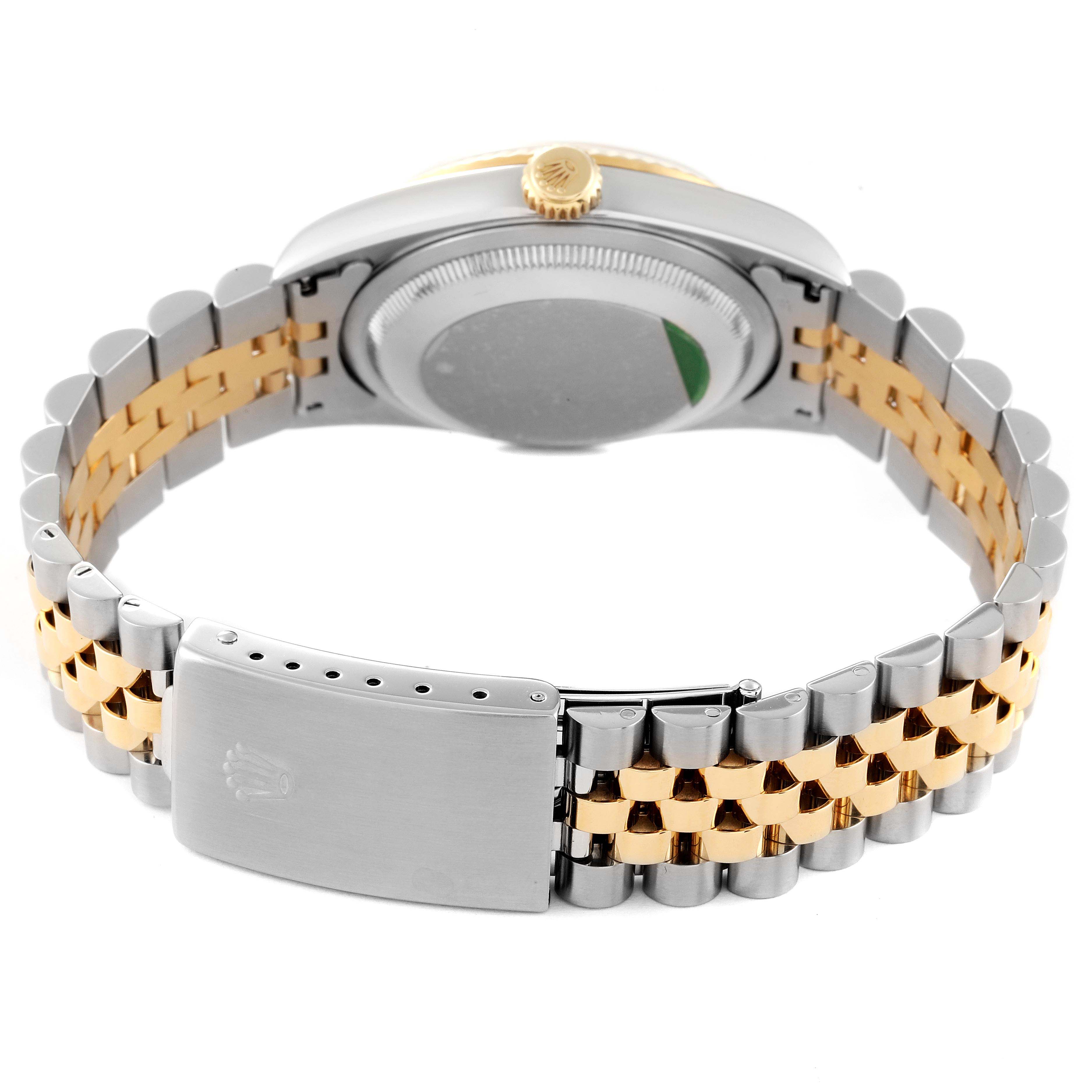 The image shows the back view of a Rolex Datejust 16233 Men's Steel and Gold (two tone) Mother of Pearl Dial 16233 Men's Steel and Gold (two tone) Mother of Pearl Dial watch, focusing on the case back and the two-tone bracelet with clasp.