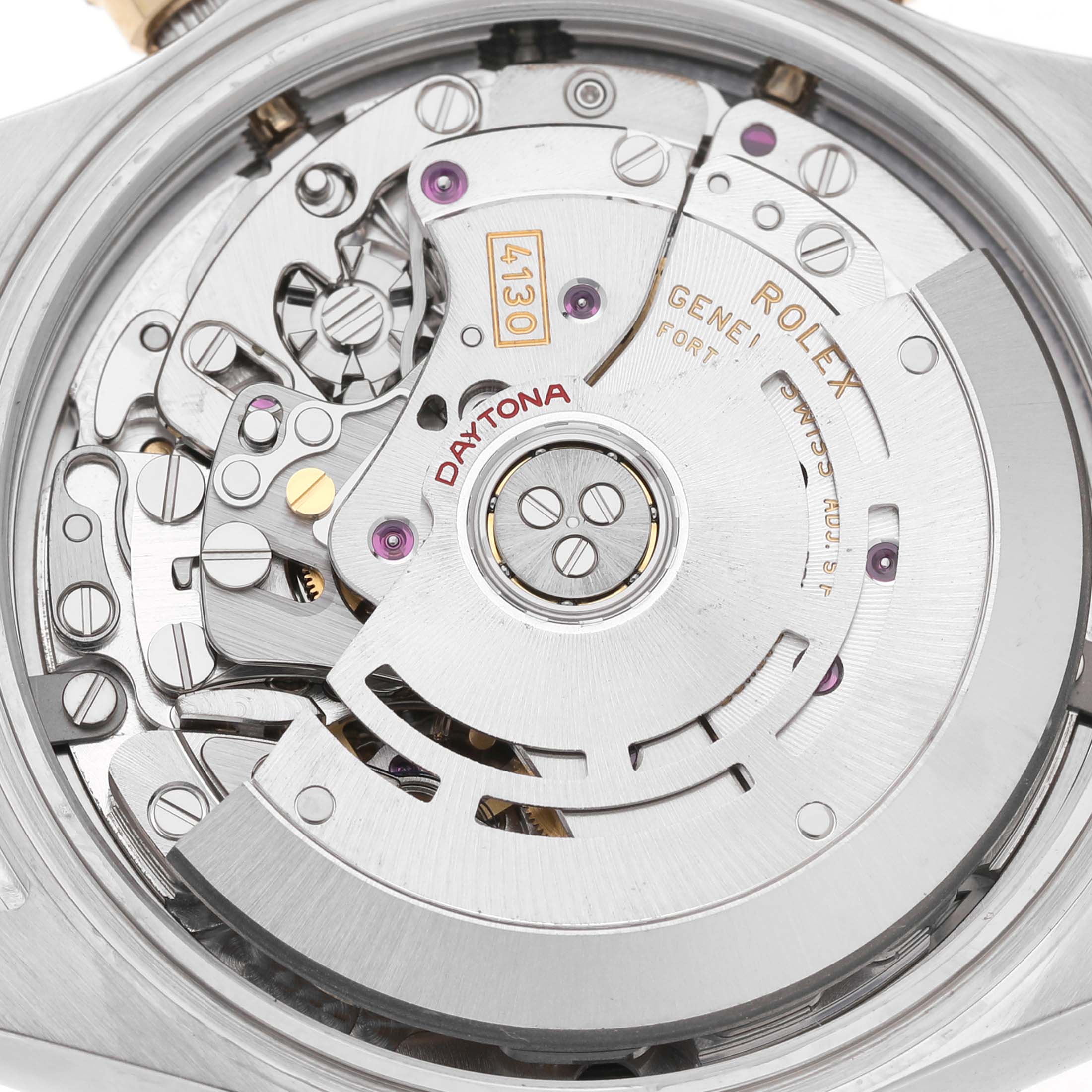 The image shows the movement of a Rolex Daytona 116503 Men's Steel and Gold (two tone) Black Dial watch, viewed from the back, displaying intricate gears and components.