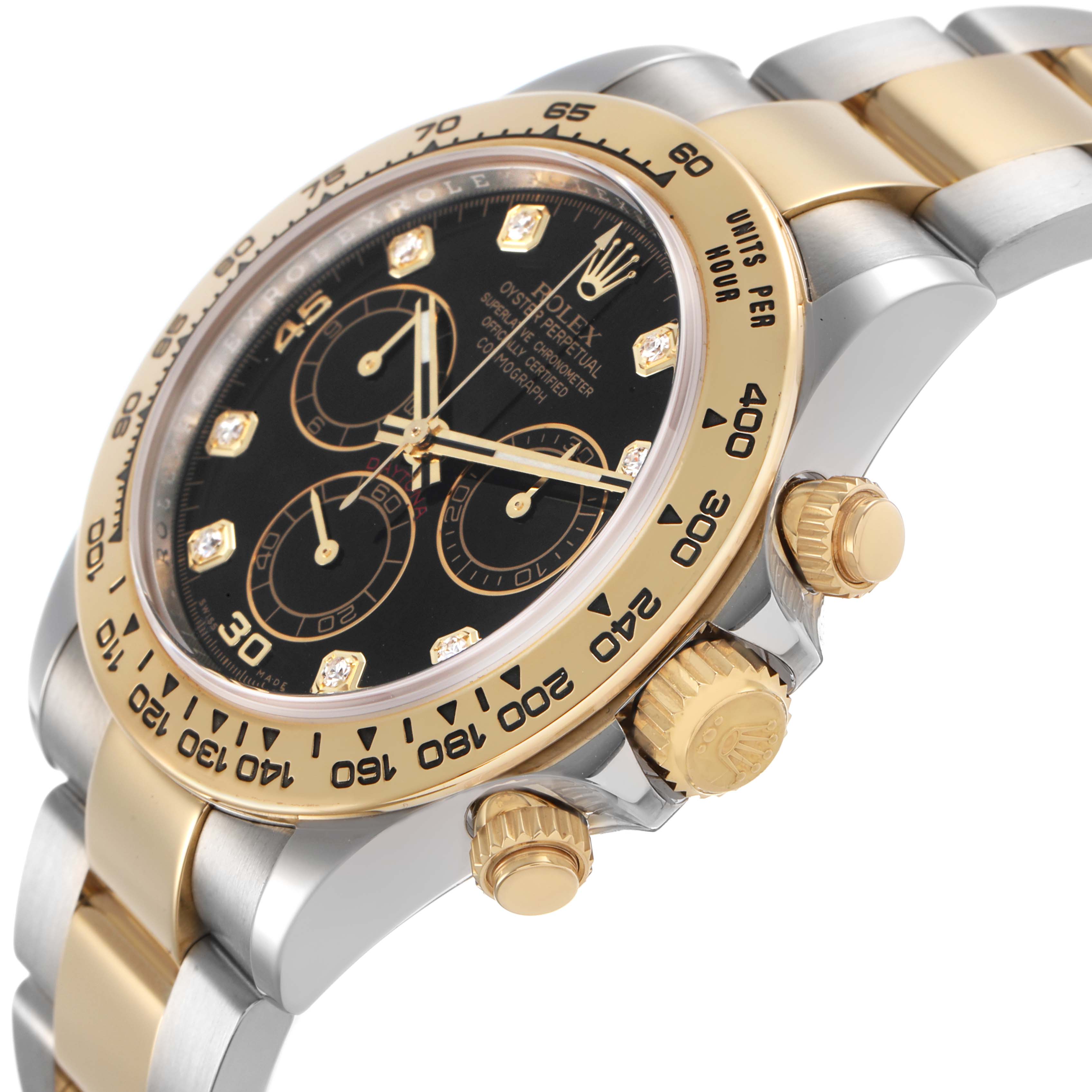 The image shows a Rolex Daytona 116503 Men's Steel and Gold (two tone) Black Dial watch from a side angle, highlighting the bezel, crown, pushers, and part of the bracelet.
