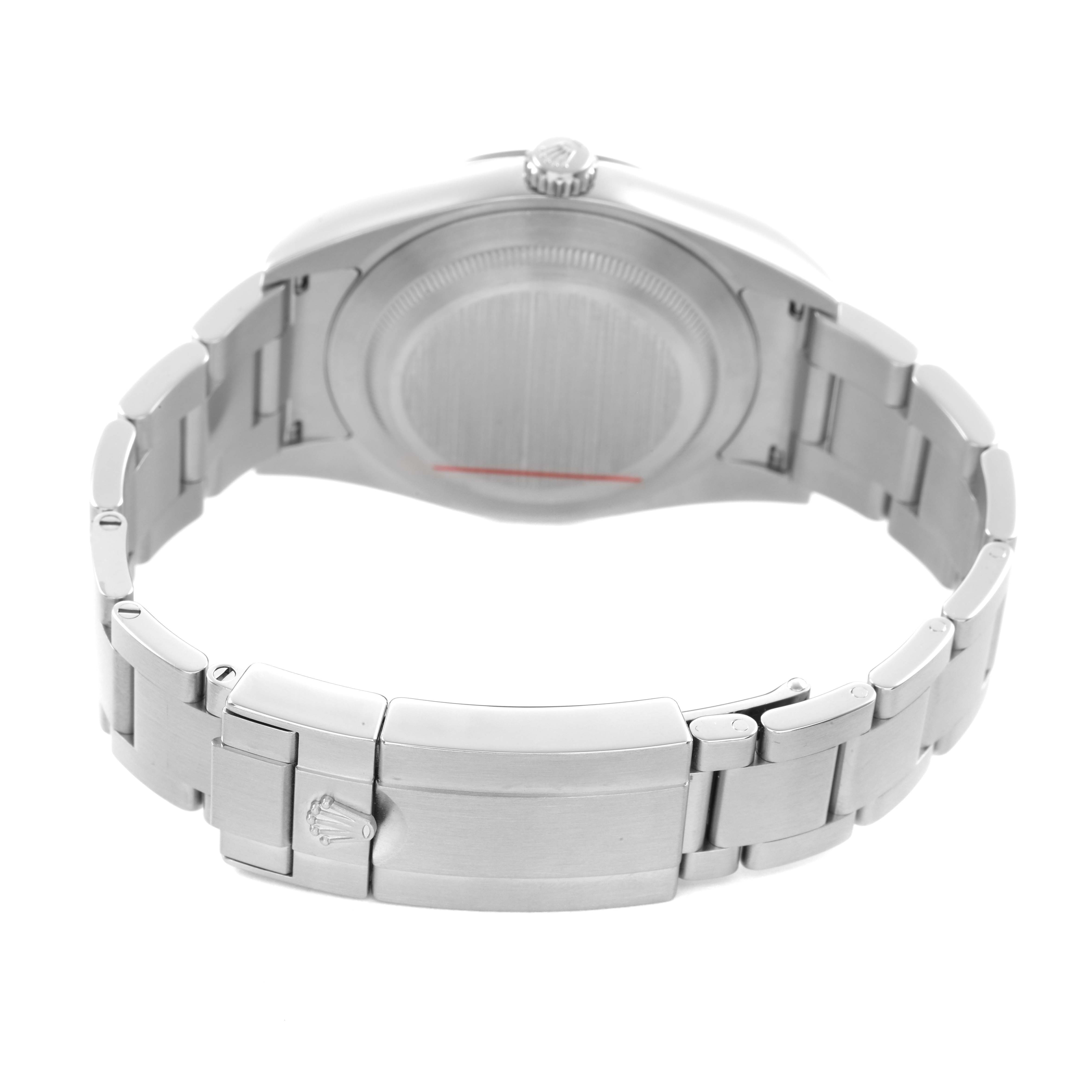 The image shows the backside of the Rolex Explorer 214270 Men's Stainless Steel Black Dial watch, highlighting the case back and metal bracelet with the clasp visible.