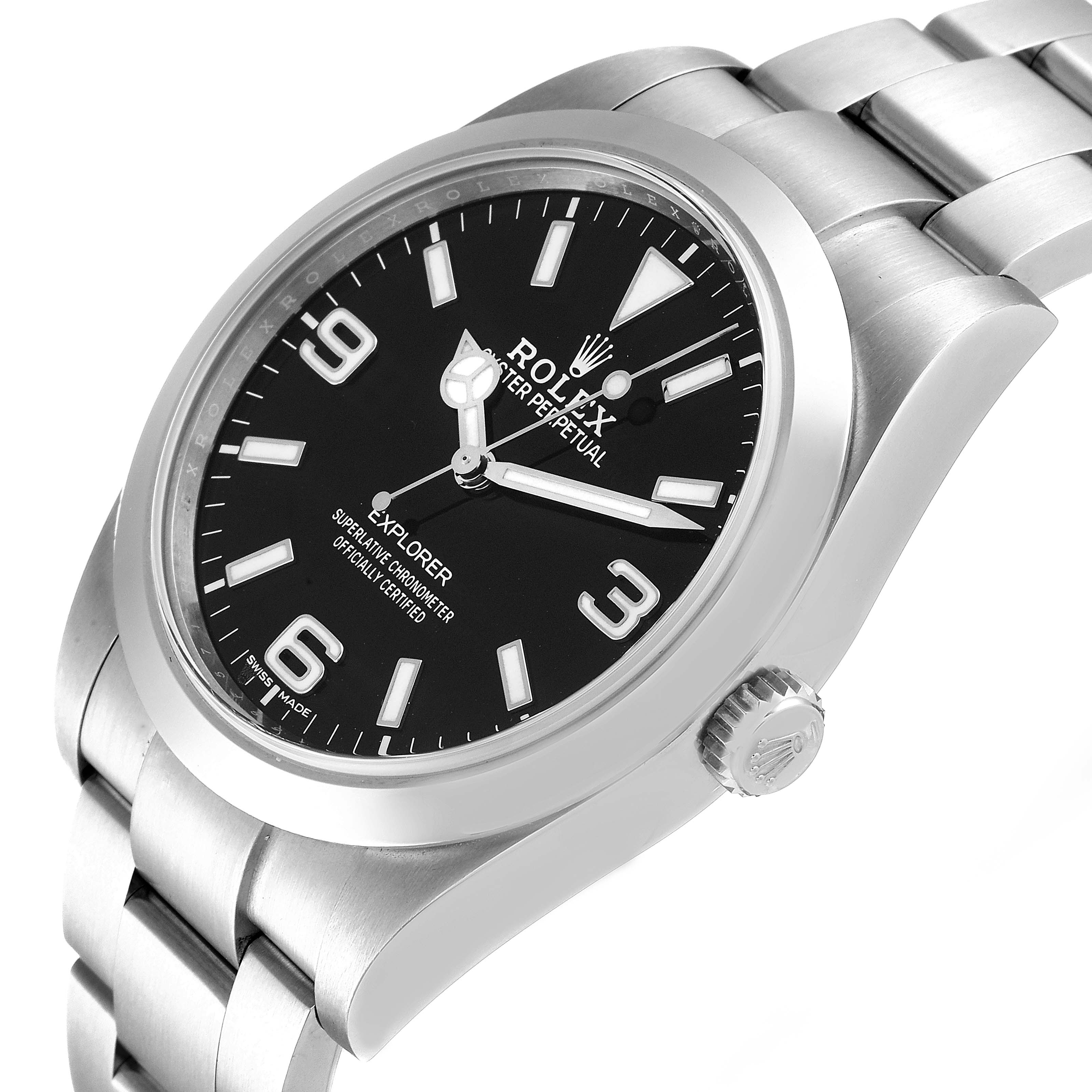 The image shows a Rolex Explorer 214270 Men
s Stainless Steel Black Dial 214270 Men
s Stainless Steel Black Dial watch at an angled view displaying the dial, hands, case, crown, and part of the bracelet.