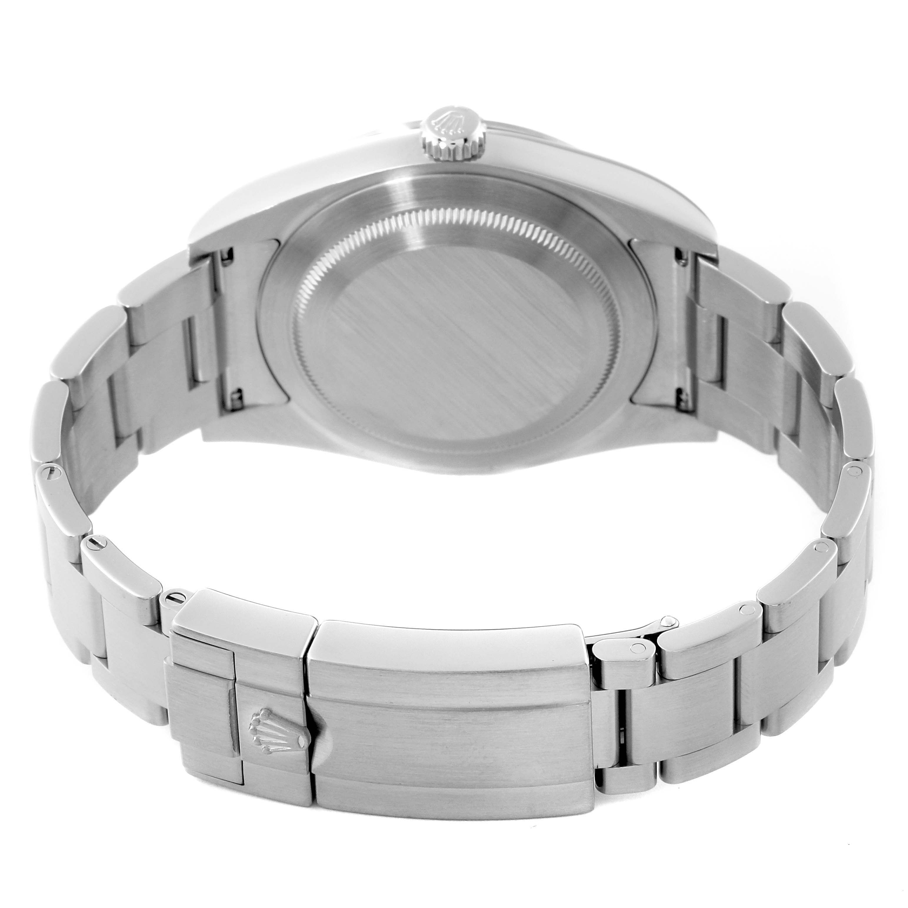 The image shows the back of a Rolex Explorer 214270 Men's Stainless Steel Black Dial 214270 Men's Stainless Steel Black Dial watch and its clasp from a straight-on angle.