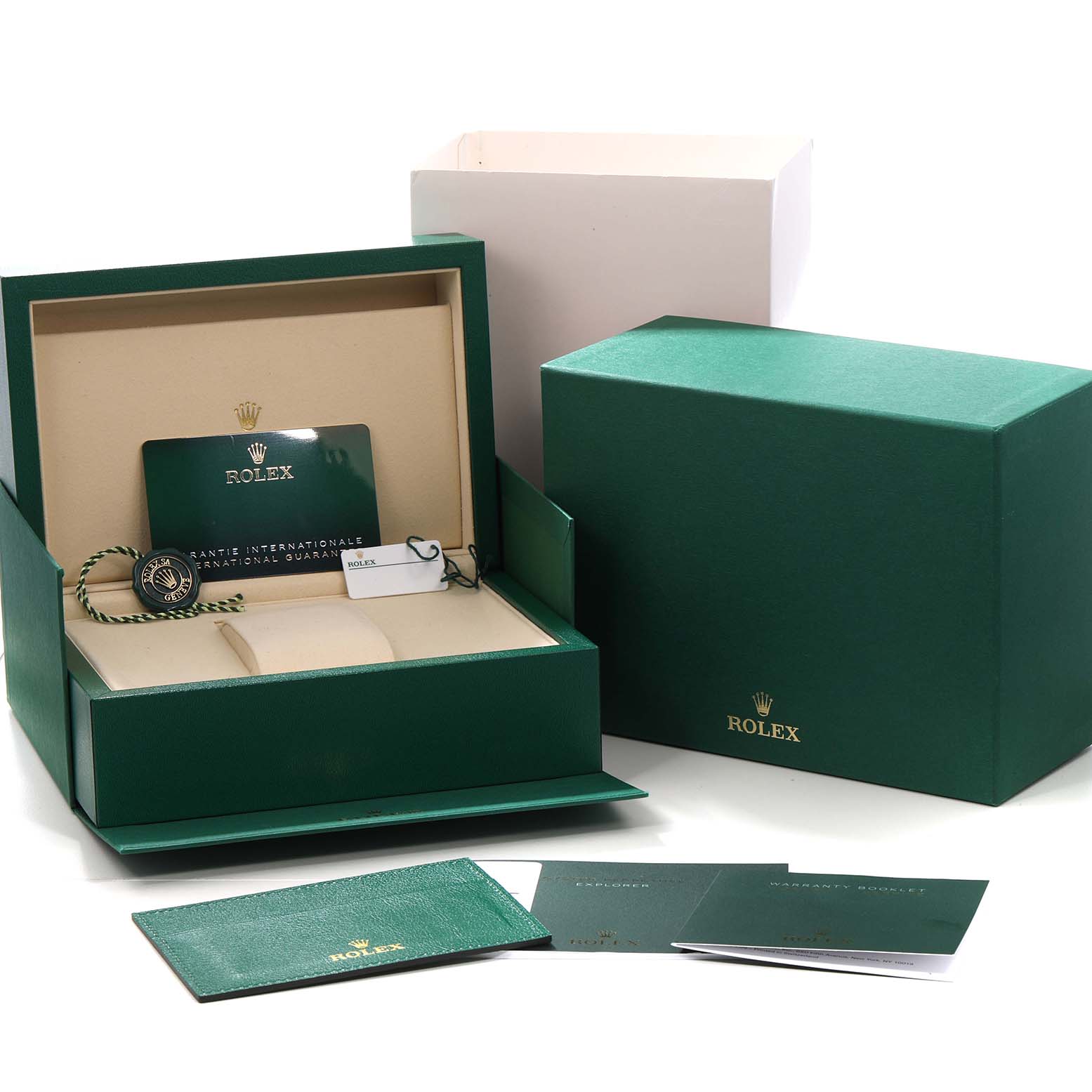 The image shows packaging for a Rolex Explorer 224270 Men's Stainless Steel Black Dial, including a green box, warranty card, and manuals.