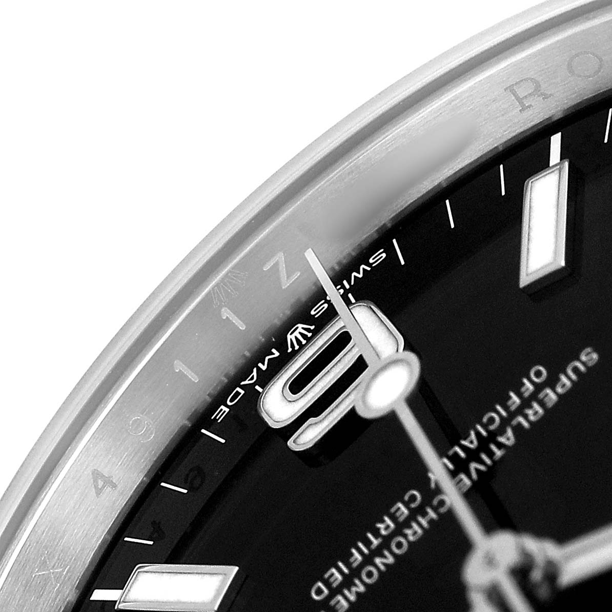 The image shows a close-up of the Rolex Explorer 224270 Men's Stainless Steel Black Dial watch face, focusing on the hour markers, hands, and part of the bezel.