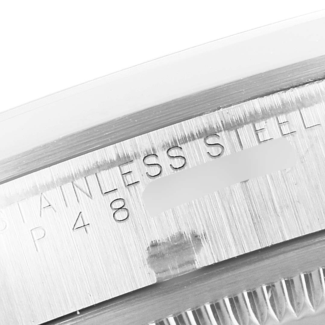 This image shows a close-up of the engraving on the side of a Rolex Explorer 14270 Men's Stainless Steel Black Dial 14270 Men's Stainless Steel Black Dial watch, highlighting the stainless steel material.