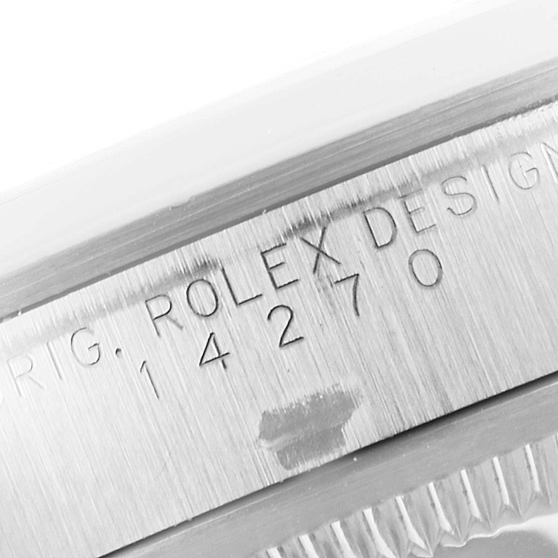 This image shows a close-up of the case with the serial number and "Rolex Design 14270" engraving for a Rolex Explorer 14270 Men's Stainless Steel Black Dial 14270 Men's Stainless Steel Black Dial watch.