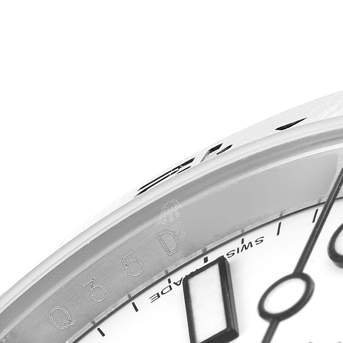 The image shows a close-up, side angle of the dial and bezel of the Rolex Explorer 216570 Men
s Stainless Steel White Dial 216570 Men
s Stainless Steel White Dial watch.
