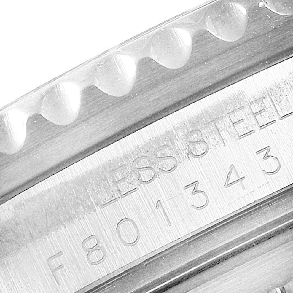 This close-up image shows the engraved serial number on the case side of the Rolex GMT-Master 16710 Men
s Stainless Steel Black Dial 16710 Men
s Stainless Steel Black Dial watch.