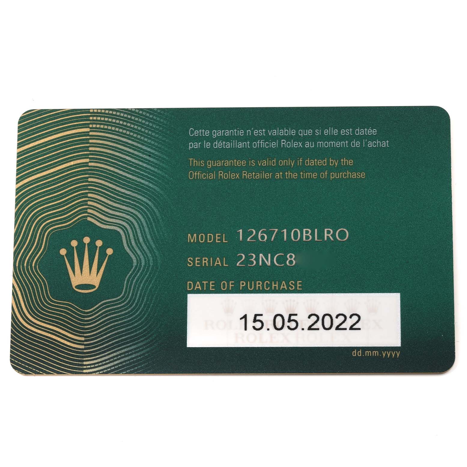 The image shows a green Rolex GMT-Master 126710 Men
s Stainless Steel Black Dial 126710 Men
s Stainless Steel Black Dial model 126710BLRO warranty card with its serial number and purchase date.