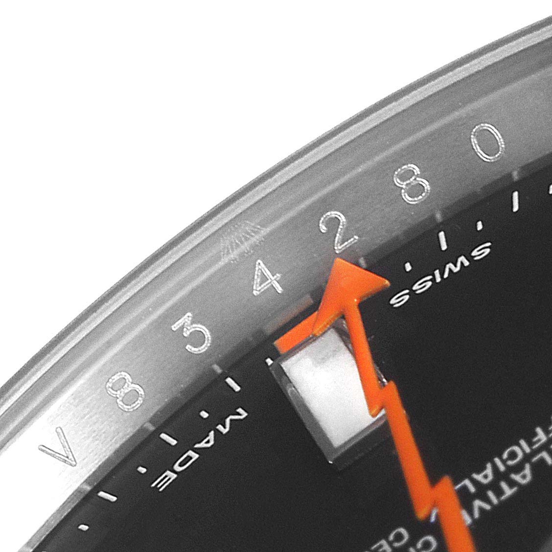 This close-up of the Rolex Milgauss 116400 Men's Stainless Steel Black Dial 116400 Men's Stainless Steel Black Dial watch shows part of the dial, a segment of the seconds hand, and part of the minute track.