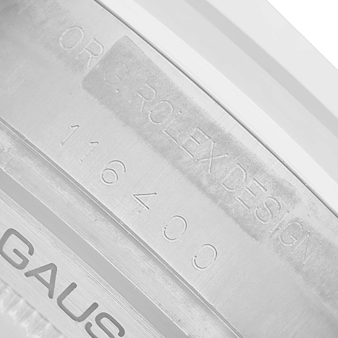 The image shows a close-up of the case engraving on a Rolex Milgauss 116400 Men's Stainless Steel Yellow Dial, displaying the model number "116400" and "ORIG ROLEX DESIGN."