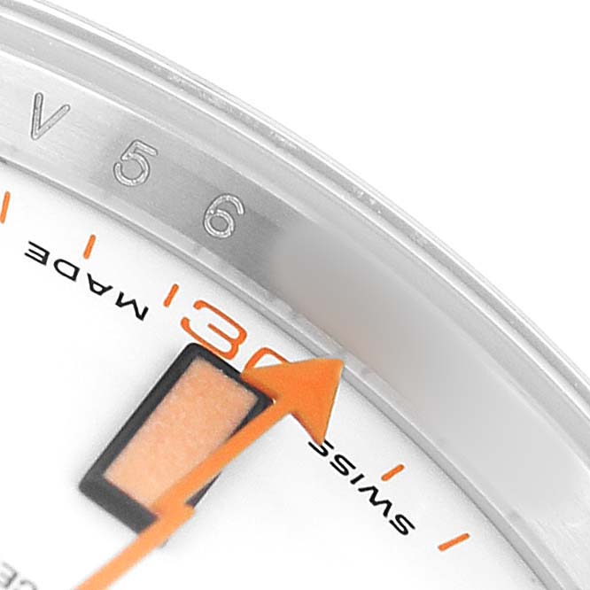 The image shows a close-up of the 5-6 marker area with the orange lightning bolt-shaped second hand on the Rolex Milgauss 116400 Men's Stainless Steel Yellow Dial watch.