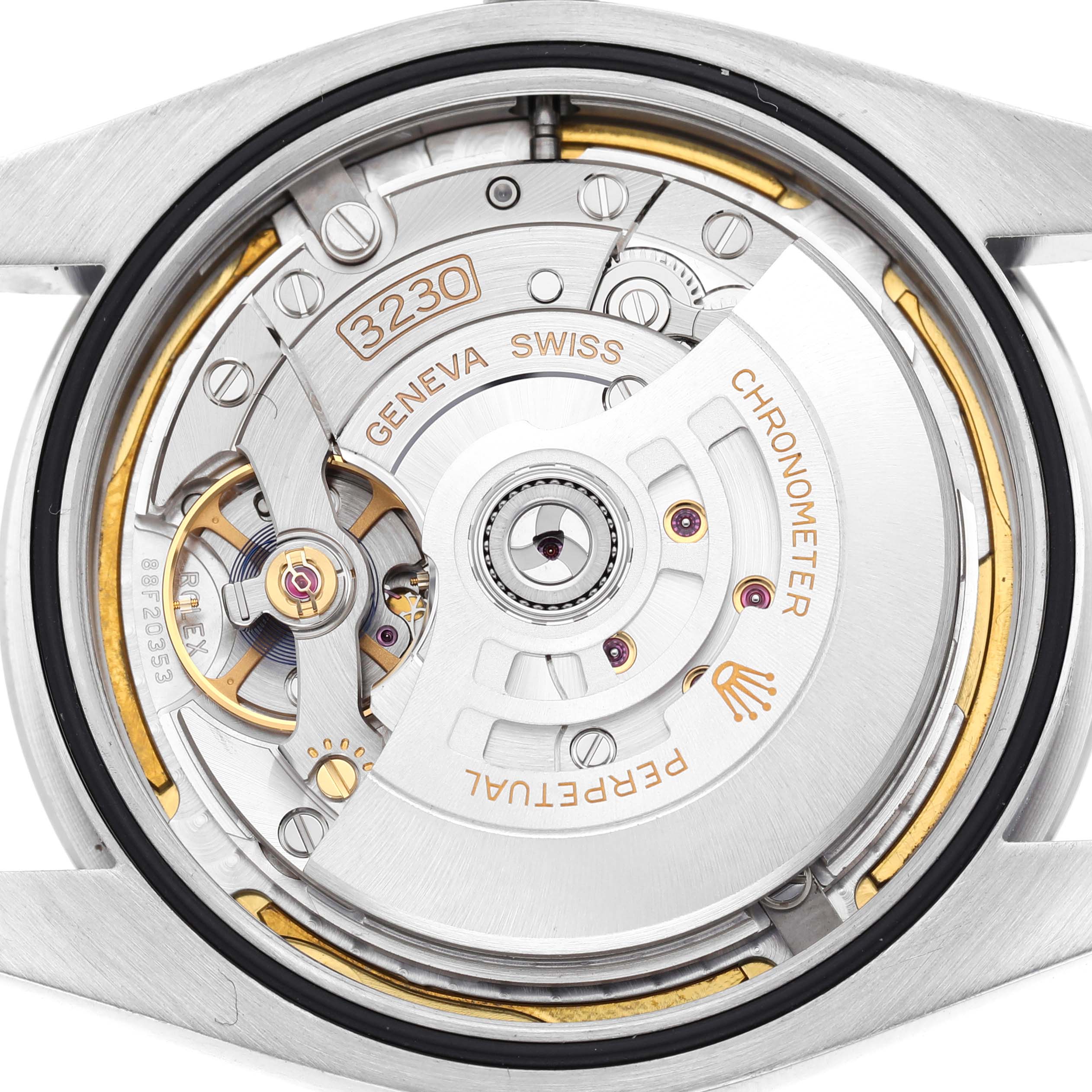 The image shows the movement mechanism of a Rolex Oyster Perpetual M124300-0005 Men's Stainless Steel Green Dial watch from a rear angle, highlighting the intricate internal components.