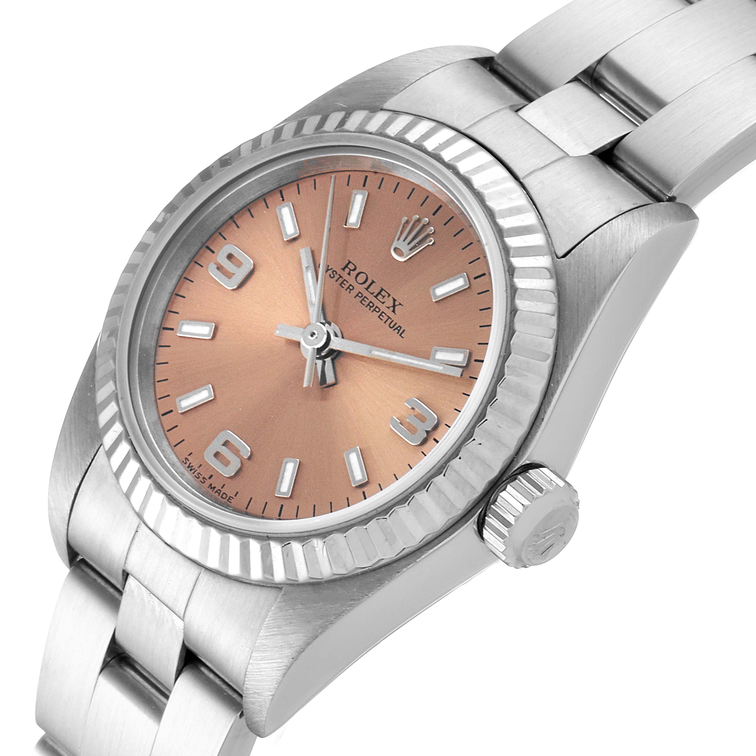 This Rolex Oyster Perpetual 76094 Women's Stainless Steel Pink Dial 76094 Women's Stainless Steel Pink Dial watch is shown at a three-quarter angle, displaying its face, bezel, crown, and part of the bracelet.