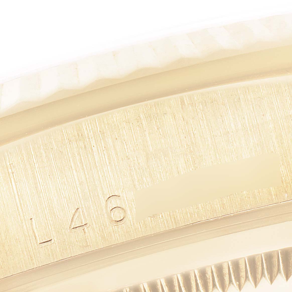 This close-up angle shows the engraving on the band of a Rolex President 18238 Men's Yellow Gold Blue Dial 18238 Men's Yellow Gold Blue Dial model watch.