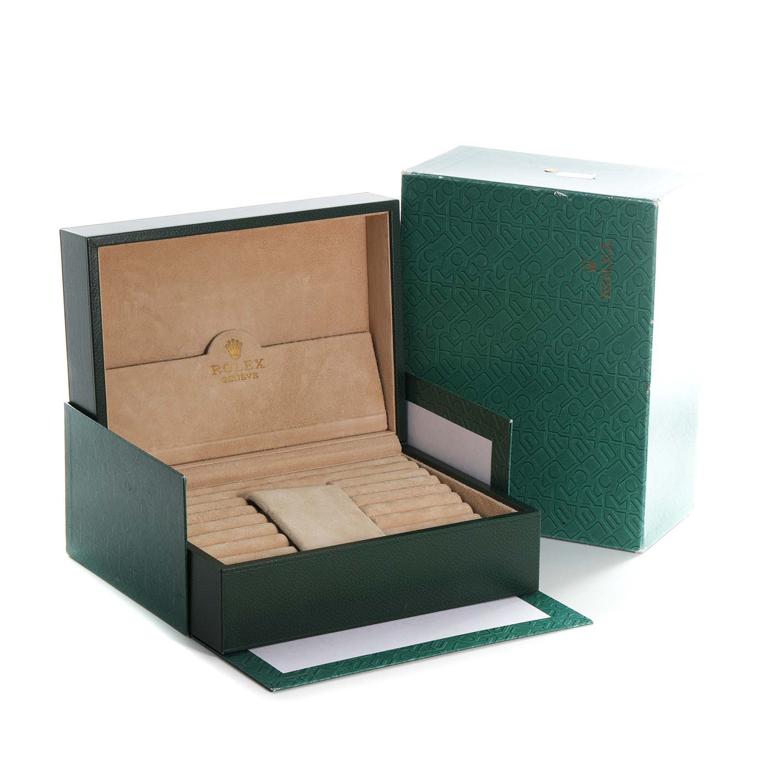 The image shows an open green case with a beige interior for the Rolex President 18238 Men's Yellow Gold Blue Dial 18238 Men's Yellow Gold Blue Dial model watch, along with its outer packaging.