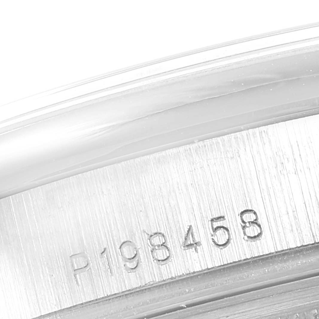 This image shows a close-up view of the serial number engraved on the side of the Rolex President 118206 Men's Platinum Blue Dial 118206 Men's Platinum Blue Dial model.