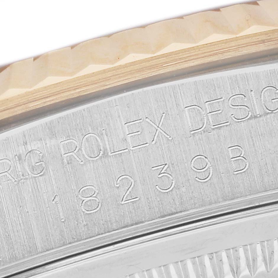 This image shows the side engraving of a Rolex President 18239 Men's Steel and Gold (two tone) Champagne Dial 18239 Men's Steel and Gold (two tone) Champagne Dial model watch, highlighting the model and serial numbers.