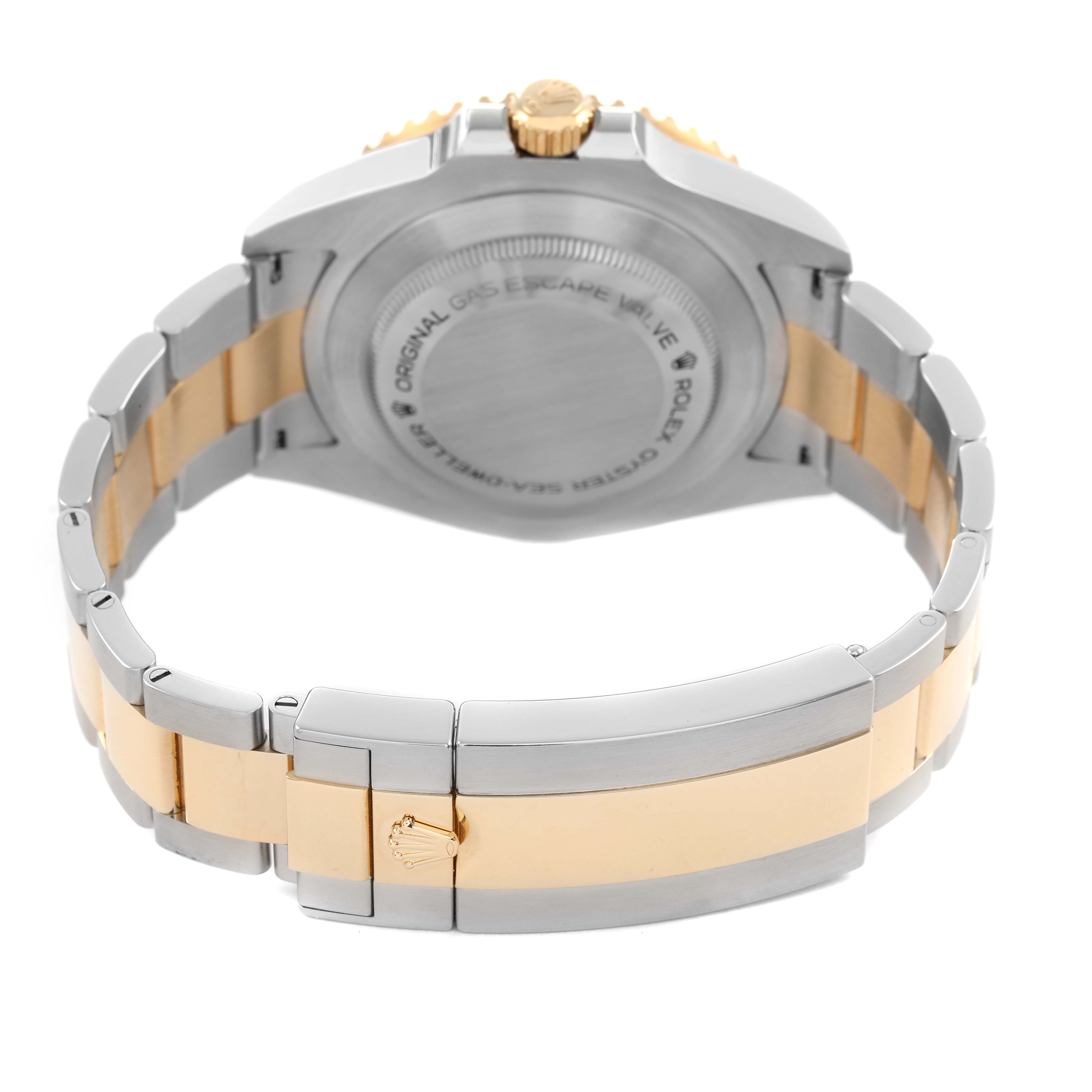 The image shows the back view of a Rolex Sea-Dweller M126603 Men's Steel and Gold (two tone) Black Dial, highlighting the case back and the two-tone bracelet.