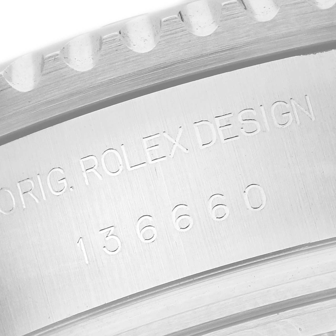 This close-up image shows the engraved model number and "Rolex Design" text on the caseback border of a Rolex Sea-Dweller 136660 Men's Stainless Steel Black Dial 136660 Men's Stainless Steel Black Dial watch.