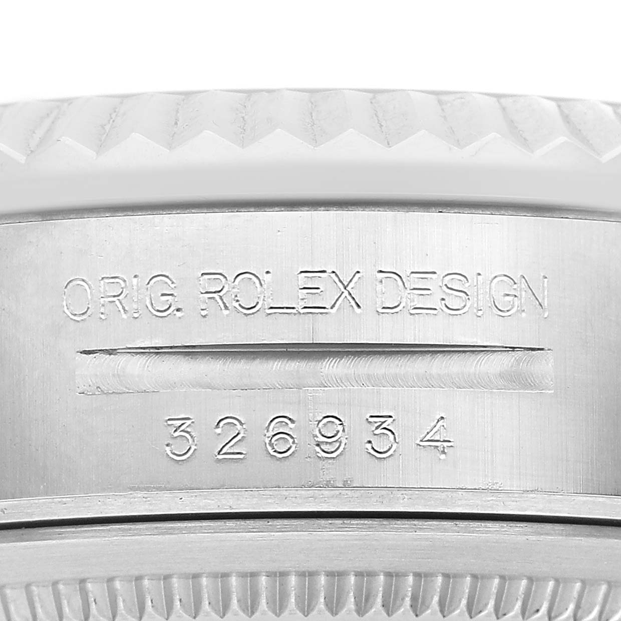 The image shows a close-up of the side of a Rolex Sky-Dweller 326934 Men's Stainless Steel Black Dial watch, highlighting the model number and design engraving.