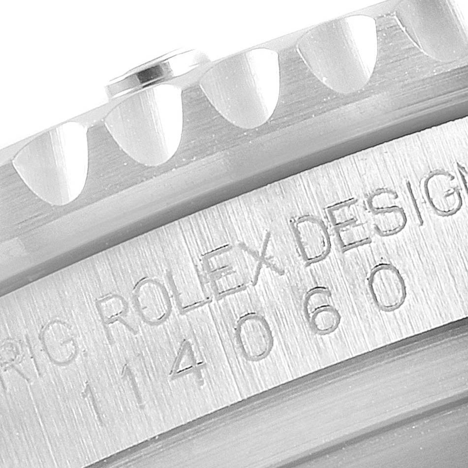 The image shows a close-up of the bezel and the model engraving on a Rolex Submariner 114060 Men
s Stainless Steel Black Dial 114060 Men
s Stainless Steel Black Dial watch.