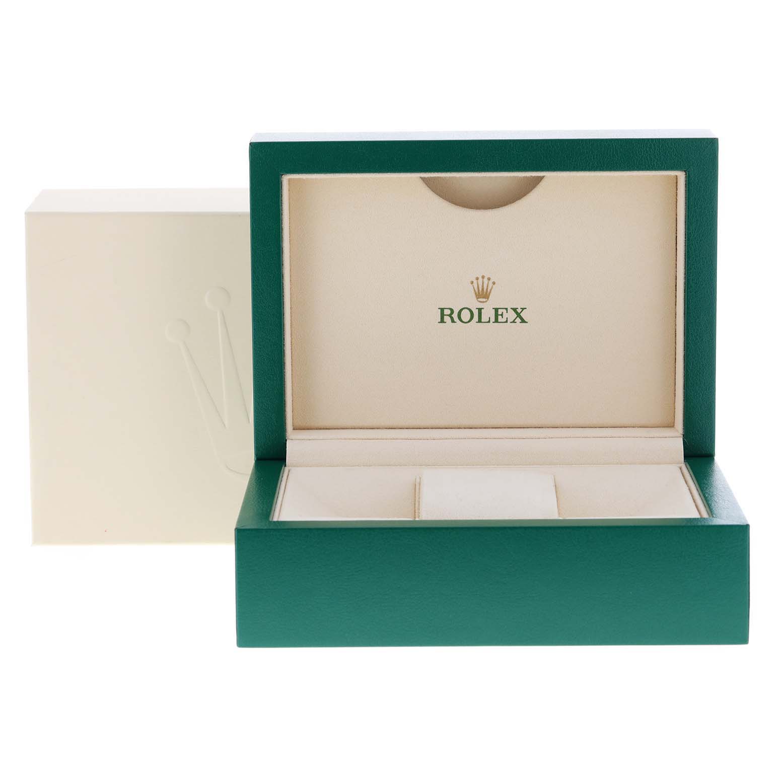 This image shows an open box for a Rolex Submariner 114060 Men
s Stainless Steel Black Dial 114060 Men
s Stainless Steel Black Dial watch, displaying its green exterior and cream interior with the Rolex logo.