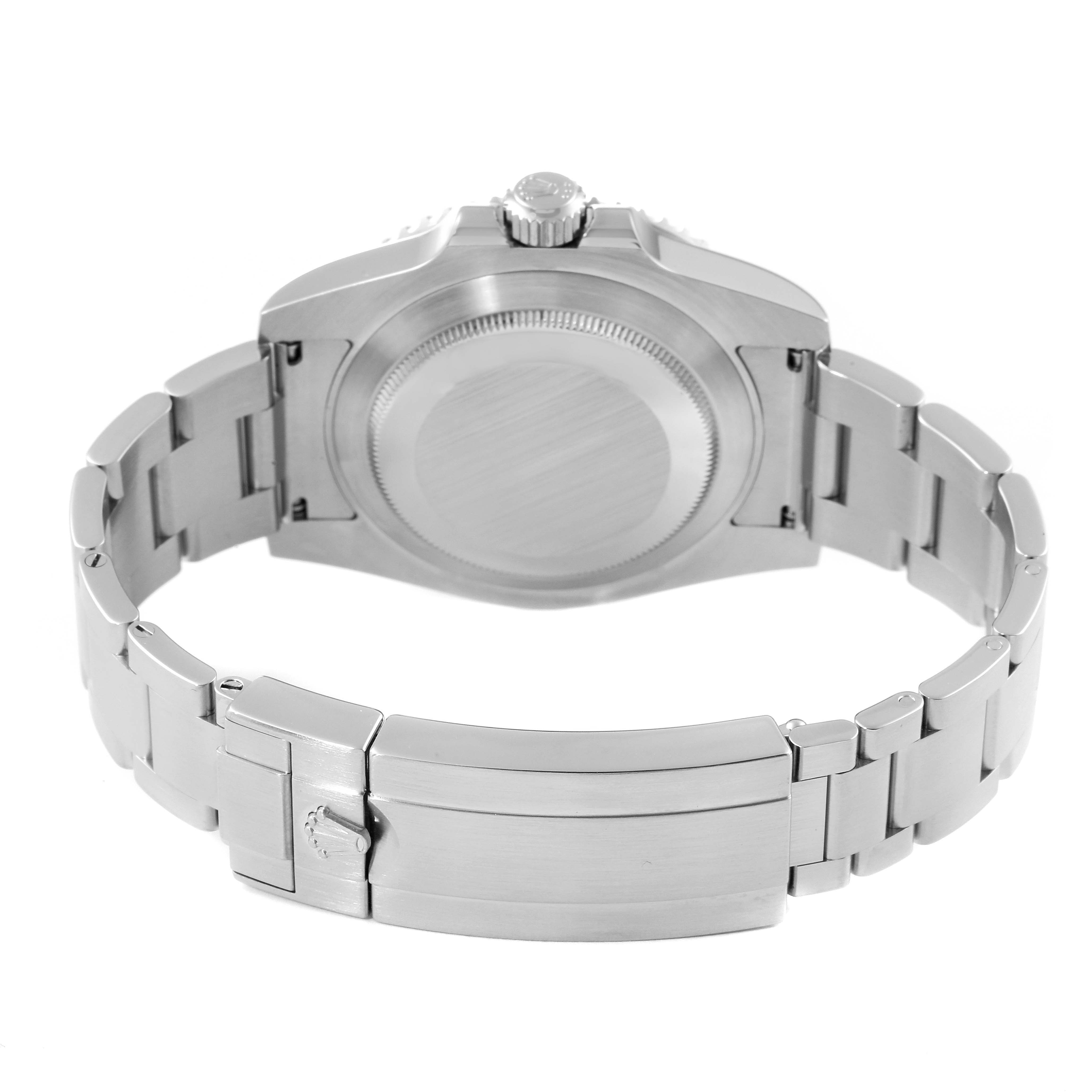 The image shows the backside of a Rolex Submariner 114060 Men
s Stainless Steel Black Dial 114060 Men
s Stainless Steel Black Dial watch, highlighting the case back and bracelet clasp.