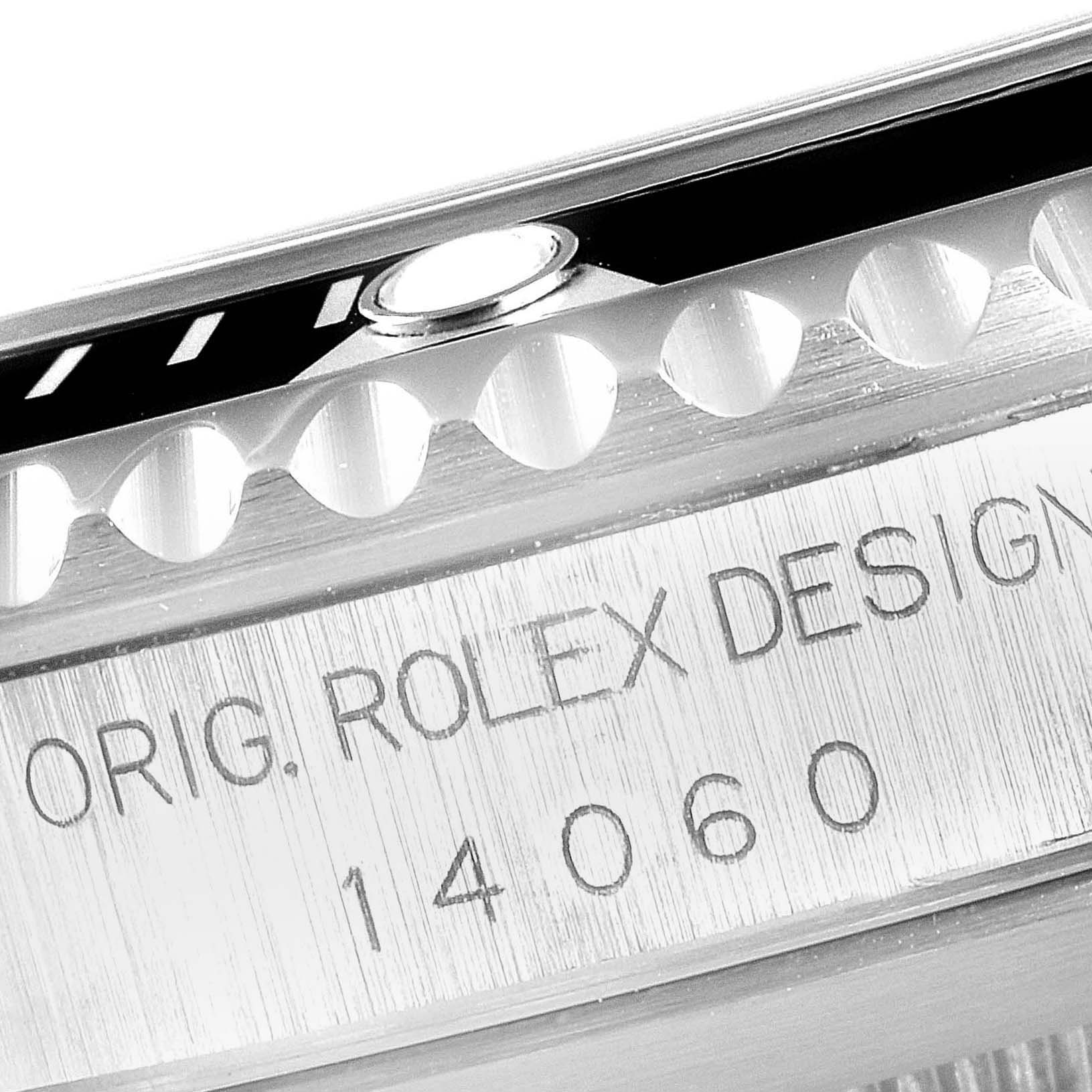 This image shows a close-up of the case side and bezel teeth of a Rolex Submariner 14060 Men
s Stainless Steel Black Dial 14060 Men
s Stainless Steel Black Dial model.