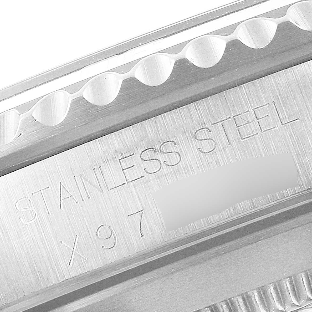 This image shows a close-up of the side engraving on a stainless steel Rolex Submariner 14060 Men
s Stainless Steel Black Dial 14060 Men
s Stainless Steel Black Dial.