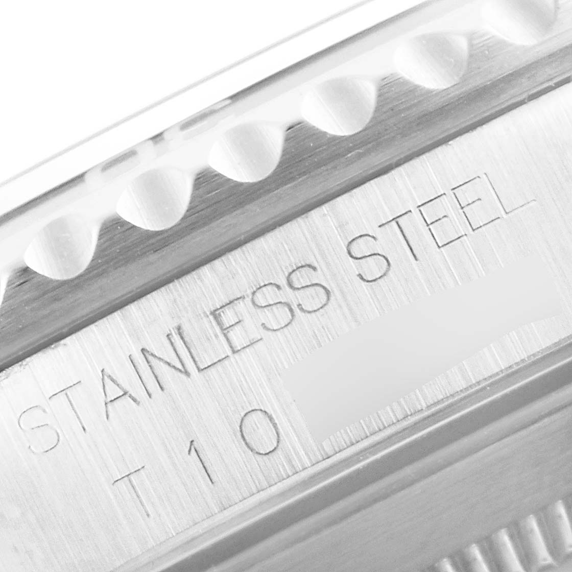 This close-up image shows the bezel and engraved stainless steel part of the Rolex Submariner 14060 Men
s Stainless Steel Black Dial 14060 Men
s Stainless Steel Black Dial watch case.