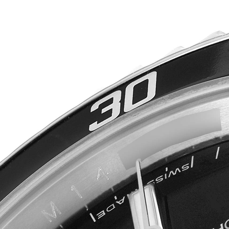 This close-up angle of the Rolex Submariner 14060 Men
s Stainless Steel Black Dial 14060 Men
s Stainless Steel Black Dial watch shows part of the bezel with the number "30" and a portion of the dial.