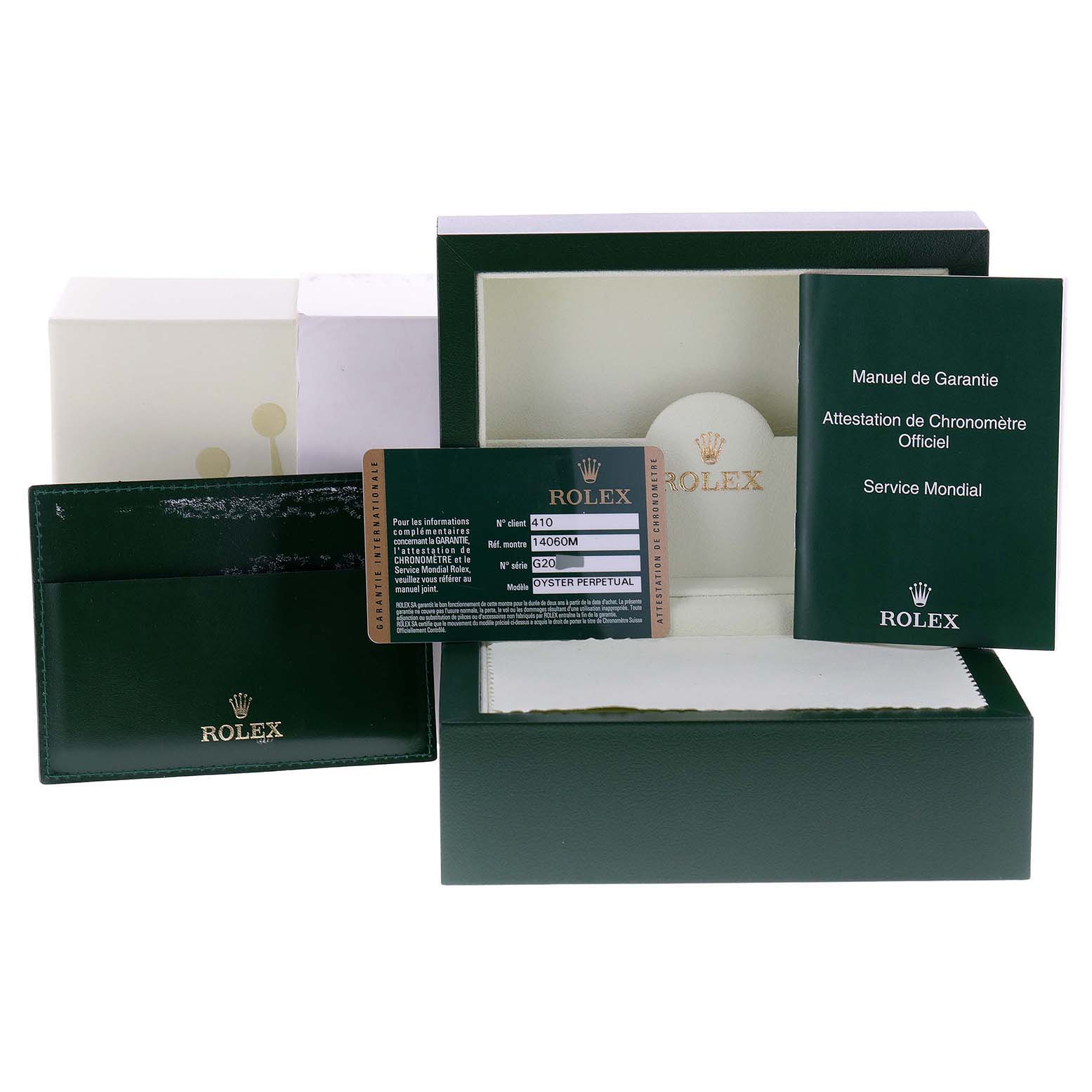 The image shows the packaging box, warranty card, and manuals for a Rolex Submariner 14060 Men
s Stainless Steel Black Dial 14060 Men
s Stainless Steel Black Dial watch.
