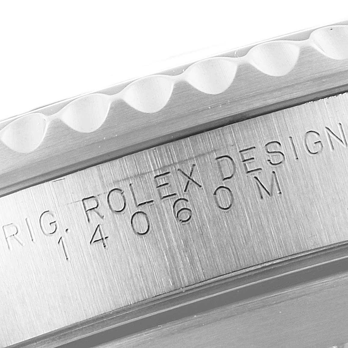The image shows a close-up angle of the side of a Rolex Submariner 14060 Men
s Stainless Steel Black Dial 14060 Men
s Stainless Steel Black Dial watch, focusing on the engraved "ROLEX DESIGN" and model number.