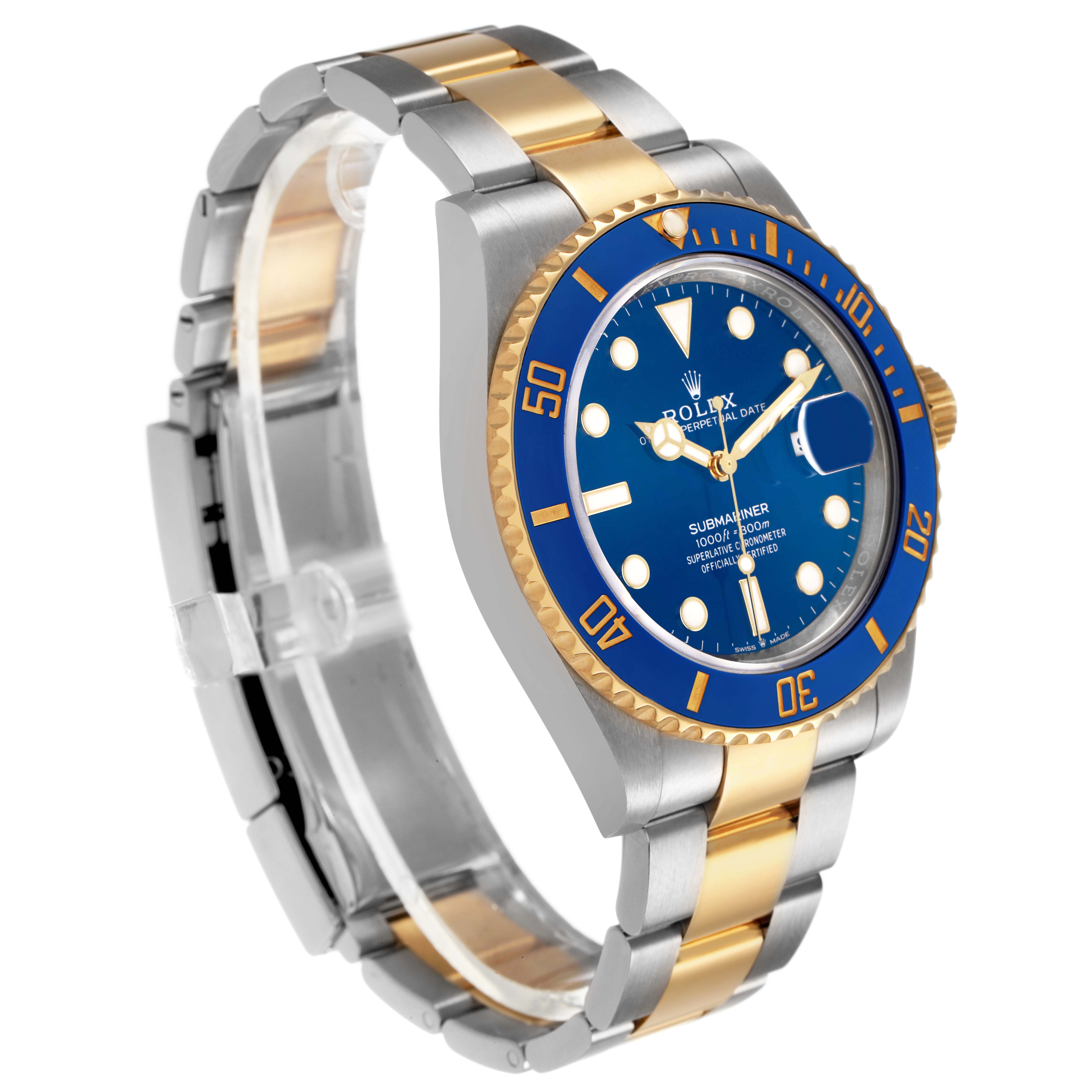 The Rolex Submariner 126613 Men's Steel and Gold (two tone) Blue Dial is shown at a three-quarter angle, displaying the blue dial, bezel, and two-tone bracelet.