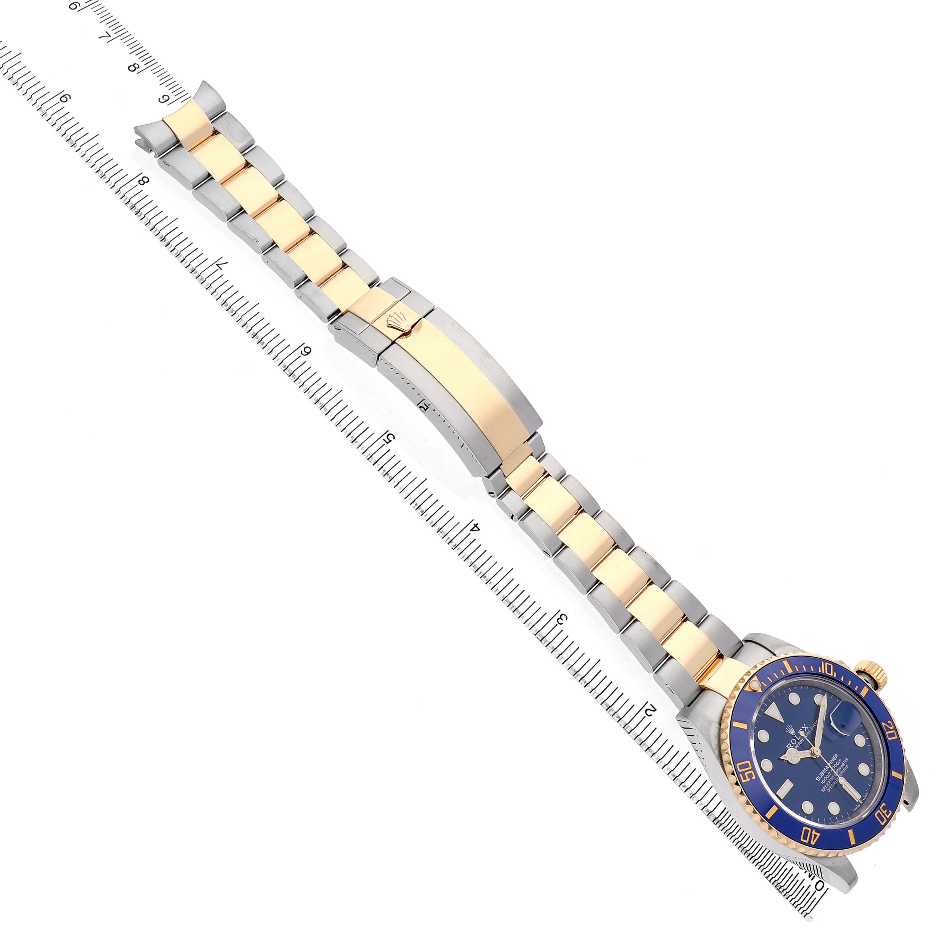 The Rolex Submariner 126613 Men's Steel and Gold (two tone) Blue Dial is shown from an angled side view, focusing on the bracelet, clasp, and the watch face.