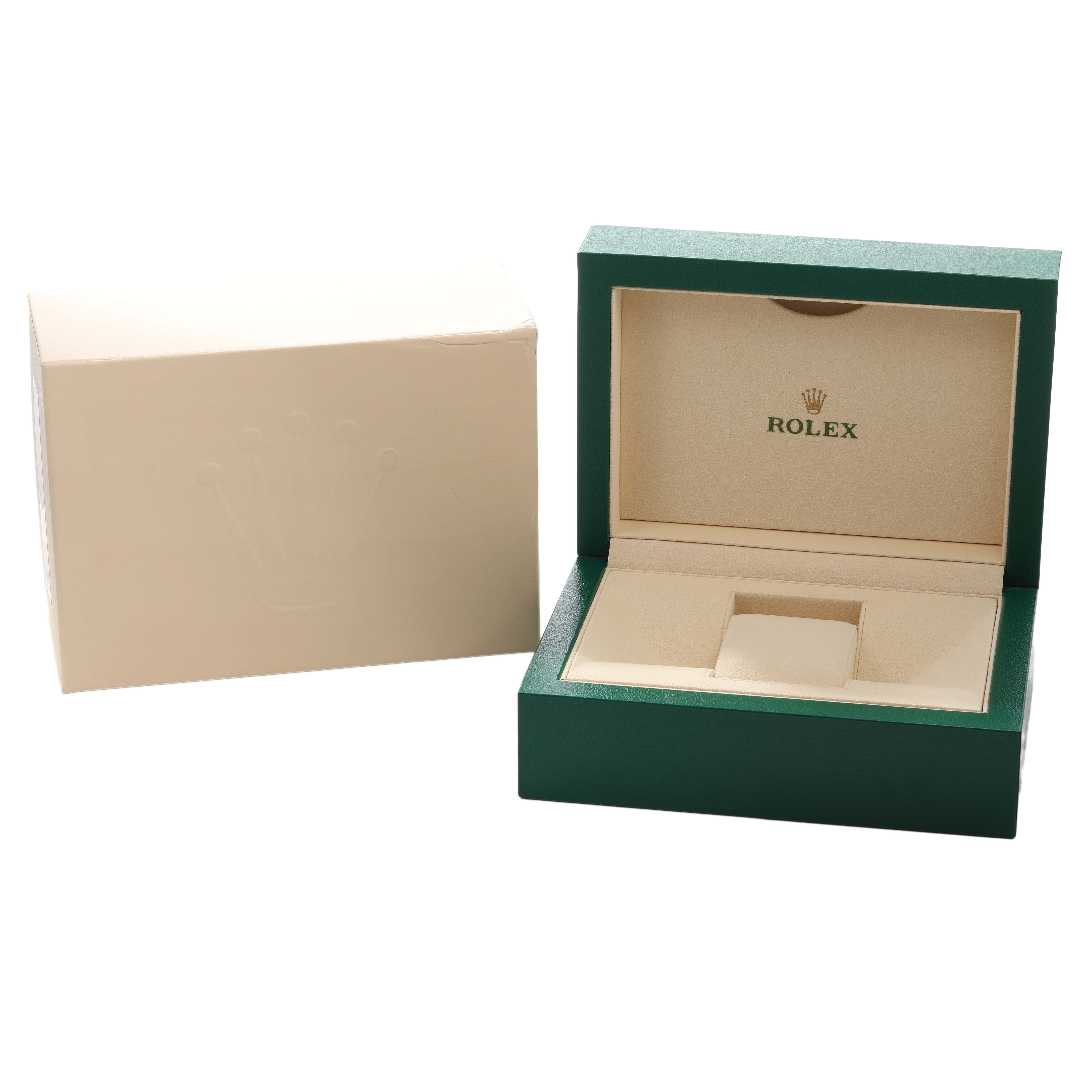 The image shows the open and empty packaging box for a Rolex Submariner 126613 Men's Steel and Gold (two tone) Blue Dial, featuring a green exterior and cream interior.