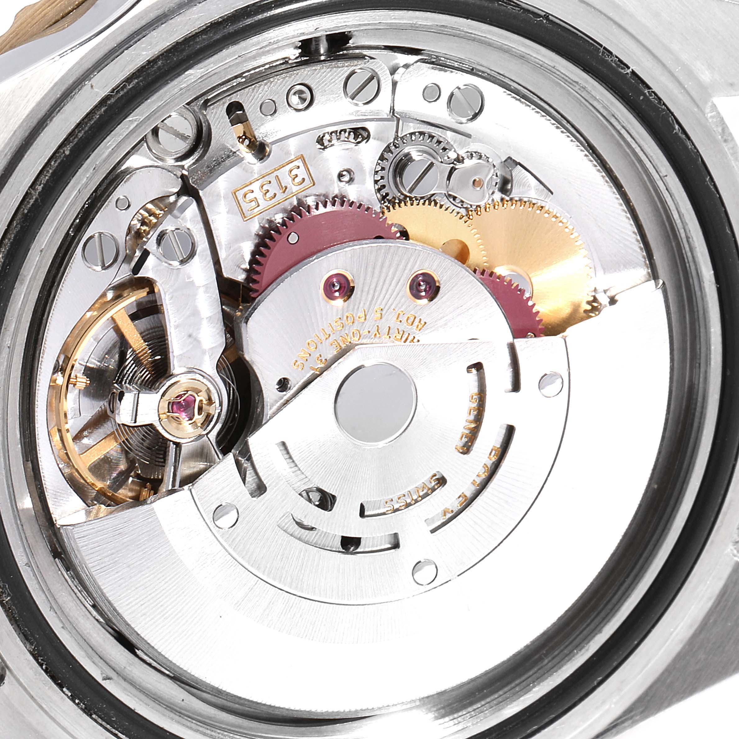 The image shows the intricate internal mechanical movement of a Rolex Submariner 16613 Men's Steel and Gold (two tone) Black Dial 16613 Men's Steel and Gold (two tone) Black Dial watch from a close-up angle.