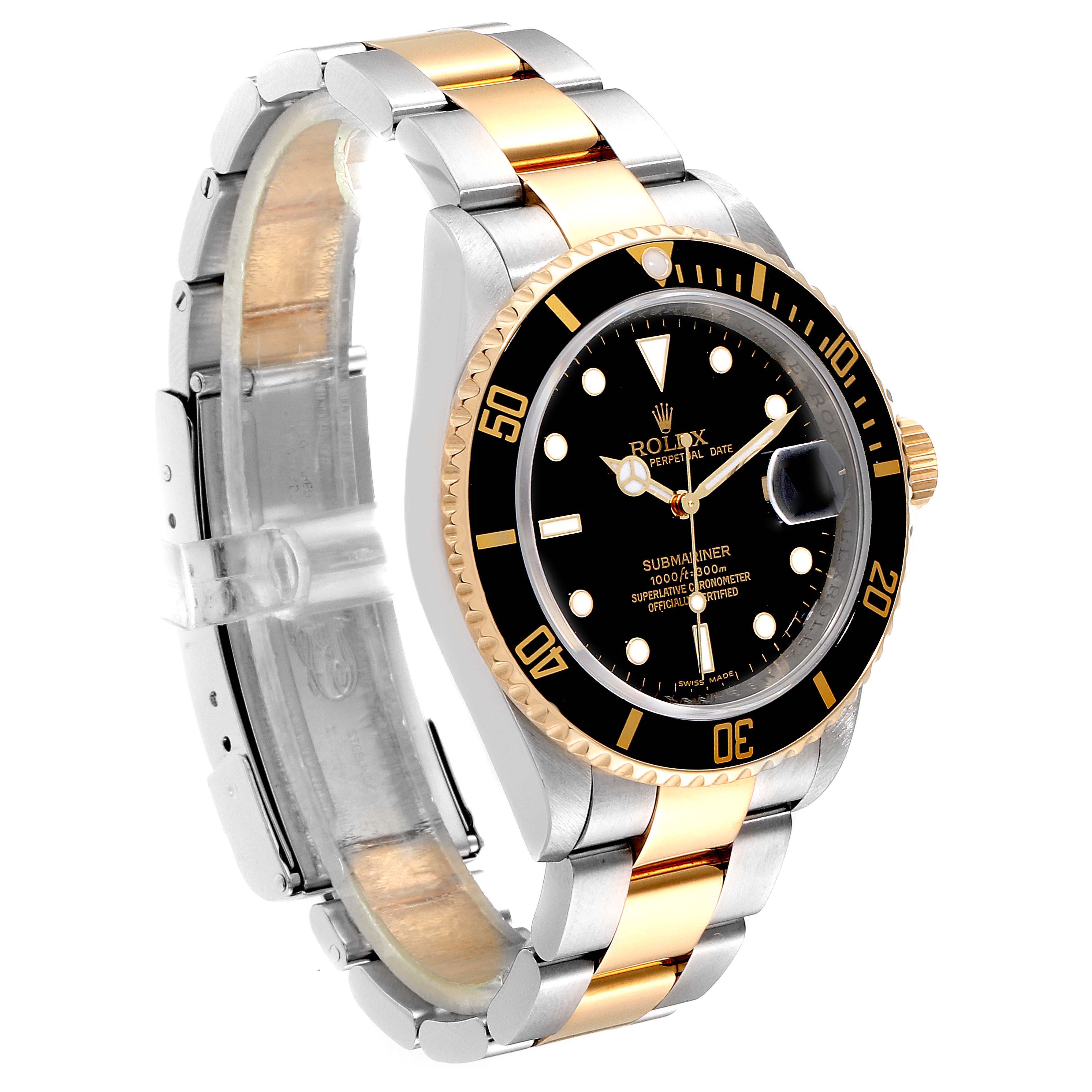 The Rolex Submariner 16613 Men's Steel and Gold (two tone) Black Dial 16613 Men's Steel and Gold (two tone) Black Dial watch is shown from a three-quarter angled view, displaying its dial, bezel, and two-tone bracelet.